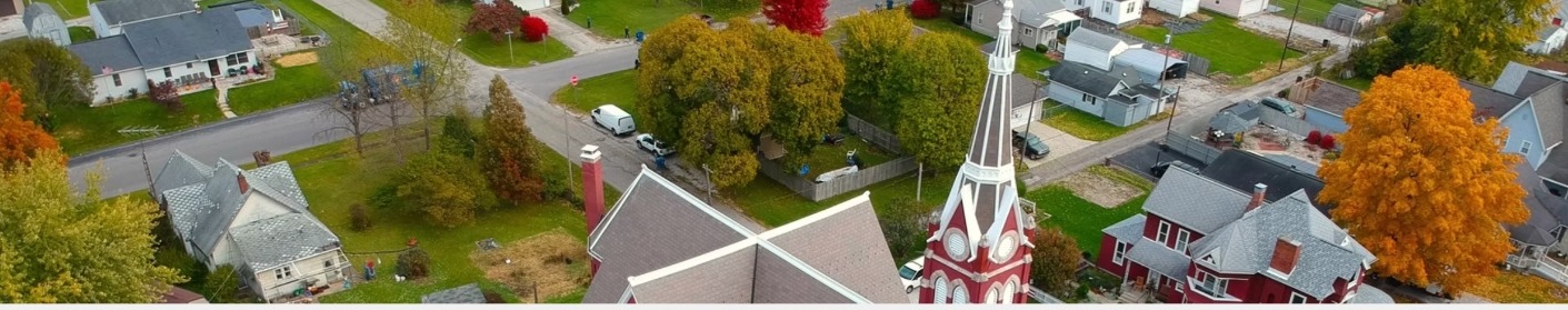 Aerial view of homes and a church in Grant County